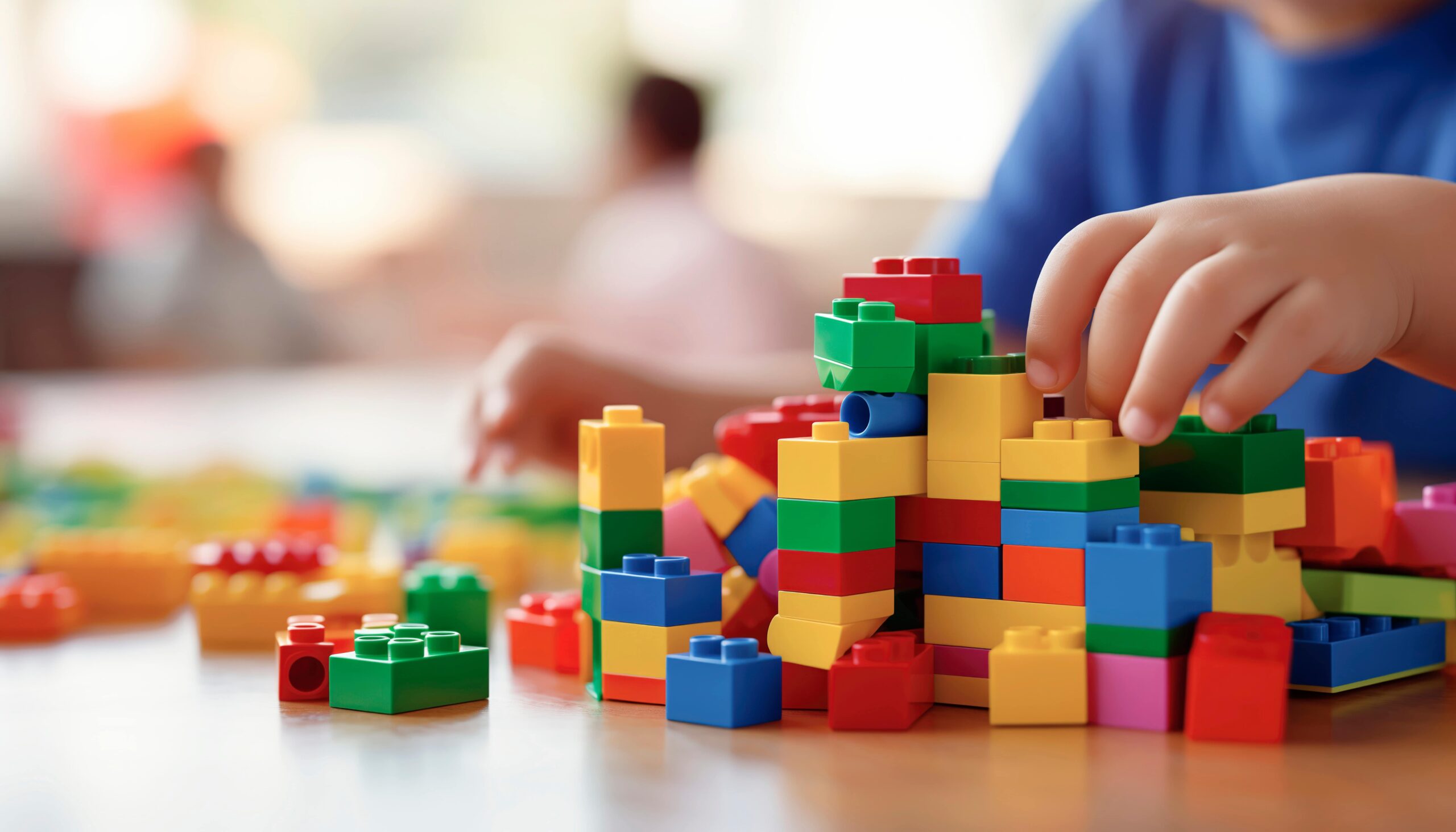 child playing with lego blocks